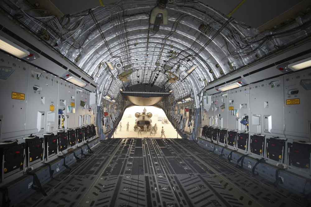 Tikrit Iraq - A CH-47 Chinook being loaded onto a C-17 Globemaster III Canvas Art - Terry MooreStocktrek Images (35 x 23)