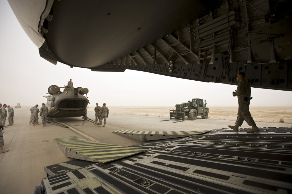 Tikrit Iraq - A CH-47 Chinook being loaded onto a C-17 Globemaster III Canvas Art - Terry MooreStocktrek Images (35 x 23)