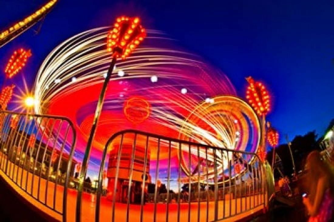Time exposure of a Carnival ride at night Canvas Art - Panoramic Images (36 x 24)