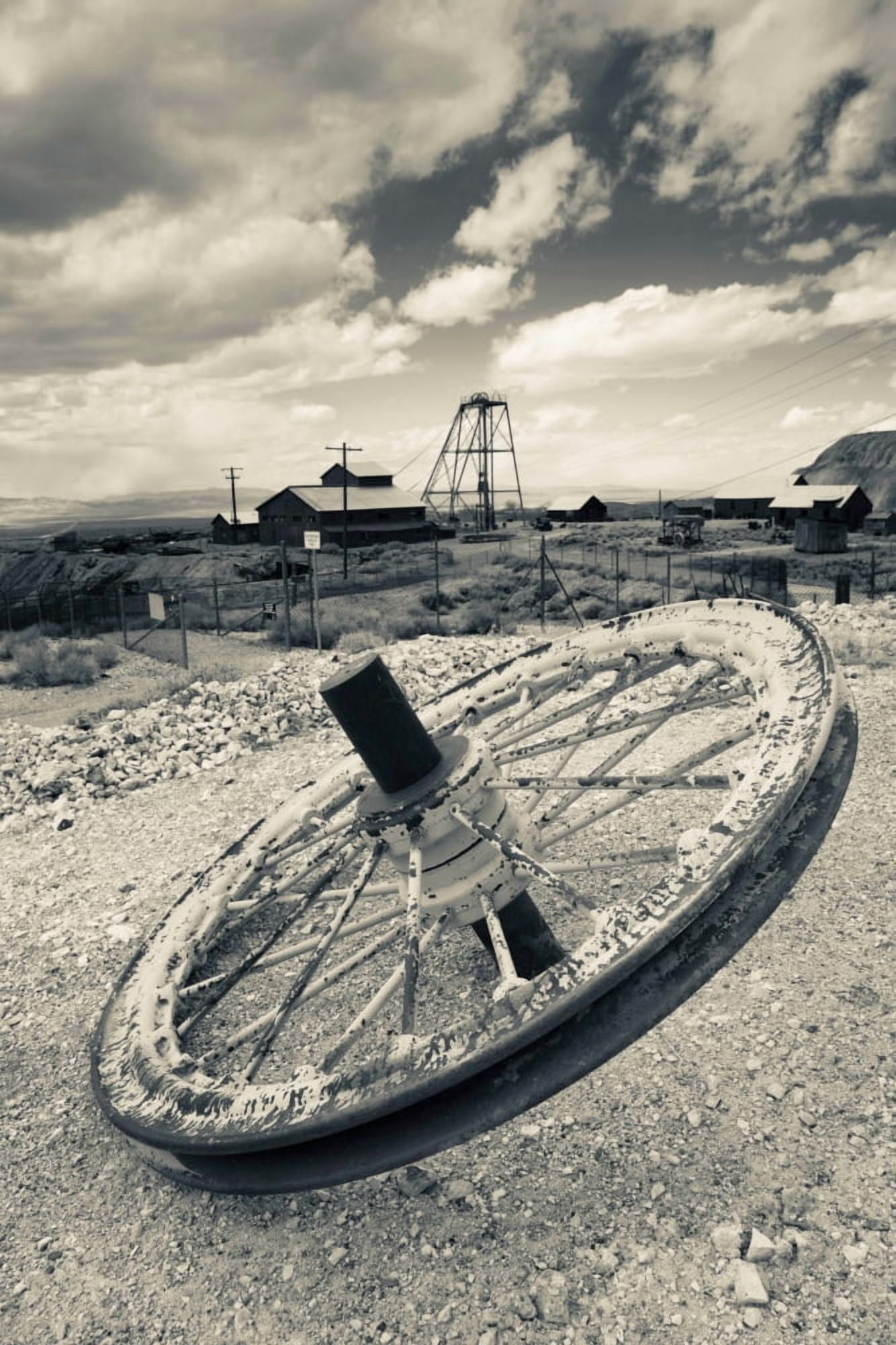 Tire with Desert Queen hoist house and mine in the background Tonopah Historic Mining Park Tonopah Great Basin Nevada USA Canvas Art - Panoramic Images (36 x 12)