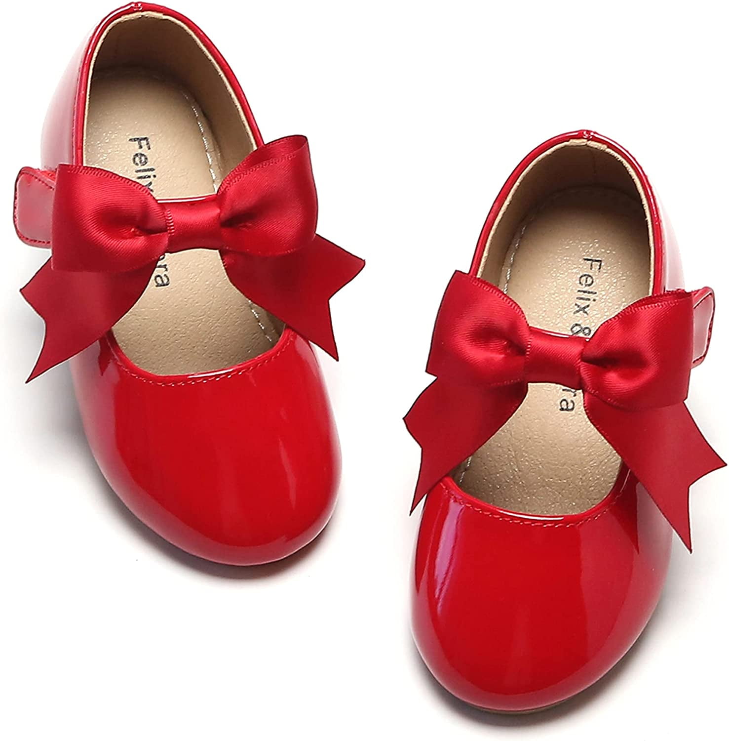 Little girl deals red flats