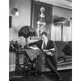 thumbnail image 1 of Tom Santchi reading in his living room Photo Print (8 x 10), 1 of 1