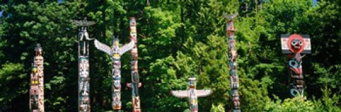 Totem poles in a a park Stanley Park Vancouver British Columbia Canada Canvas Art - Panoramic Images (18 x 6)