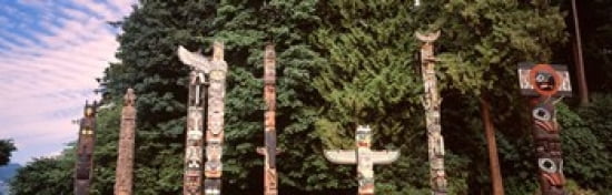 Totem poles in a park Stanley Park Vancouver British Columbia Canada Canvas Art - Panoramic Images (36 x 12)