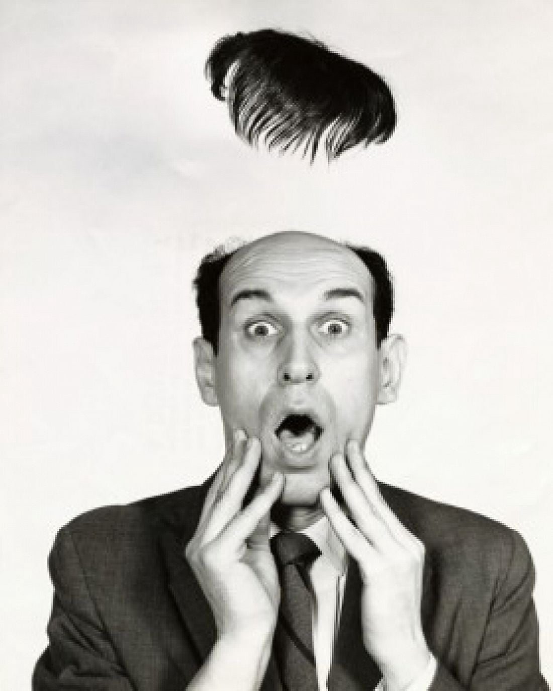 Toupe flying off of a surprised businessmans head Canvas Art - (18 x 24)