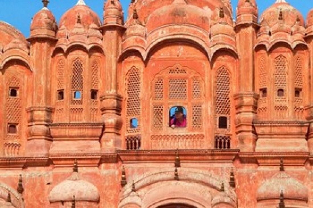 Tourist by Window of Hawa Mahal Palace of Winds Jaipur Rajasthan India Canvas Art - Keren Su DanitaDelimont (36 x 24)