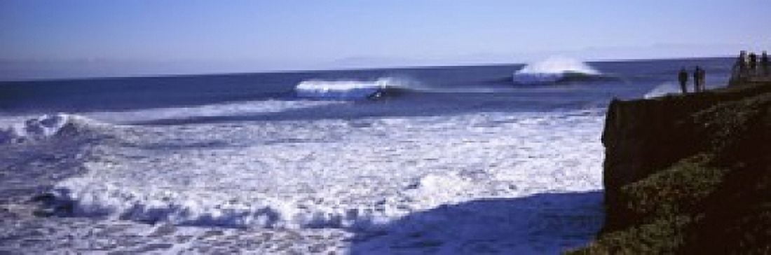 Tourist looking at waves in the sea Santa Cruz Santa Cruz County California USA Canvas Art - Panoramic Images (18 x 6)