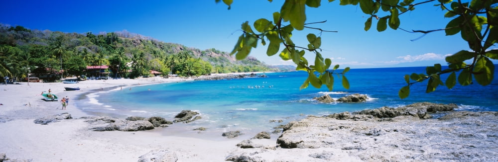 Tourist on the beach Montezuma Costa Rica Canvas Art - Panoramic Images (27 x 9)