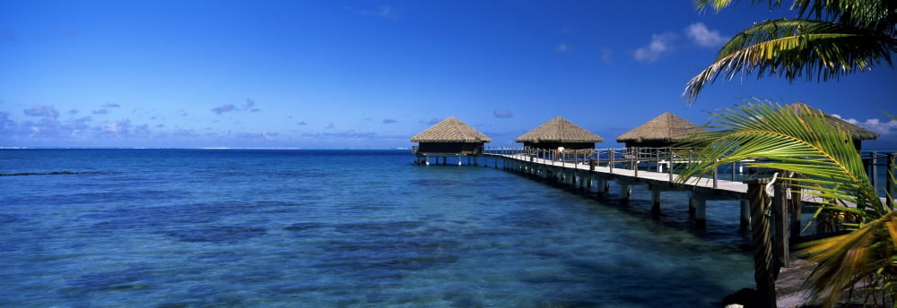 Tourist resort on a pier at dusk Tahiti French Polynesia Canvas Art - Panoramic Images (36 x 12)