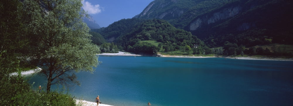 Tourists at lakeshore Lake Tenno Italy Canvas Art - Panoramic Images (27 x 9)