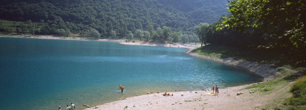 Tourists at lakeshore Lake Tenno Italy Canvas Art - Panoramic Images (36 x 12)