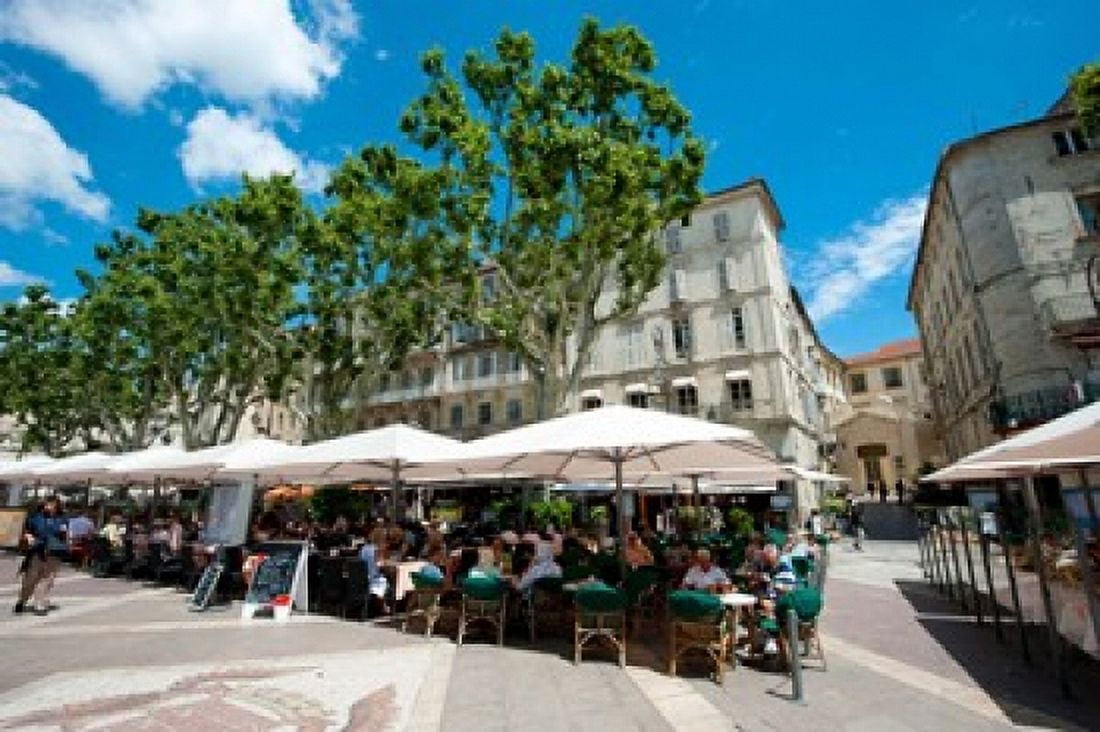Tourists at sidewalk cafes Place de lHorloge Avignon Vaucluse Provence-Alpes-Cote dAzur France Canvas Art - Panoramic Images (36 x 24)