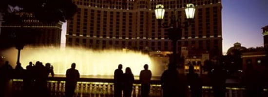 Tourists looking at a fountain Las Vegas Clark County Nevada USA Canvas Art - Panoramic Images (36 x 13)