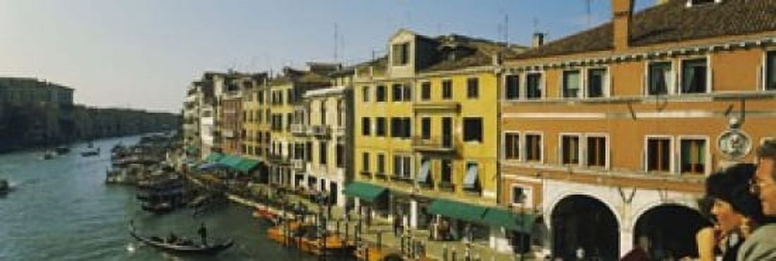 Tourists looking at gondolas in a canal Venice Italy Canvas Art - Panoramic Images (18 x 6)
