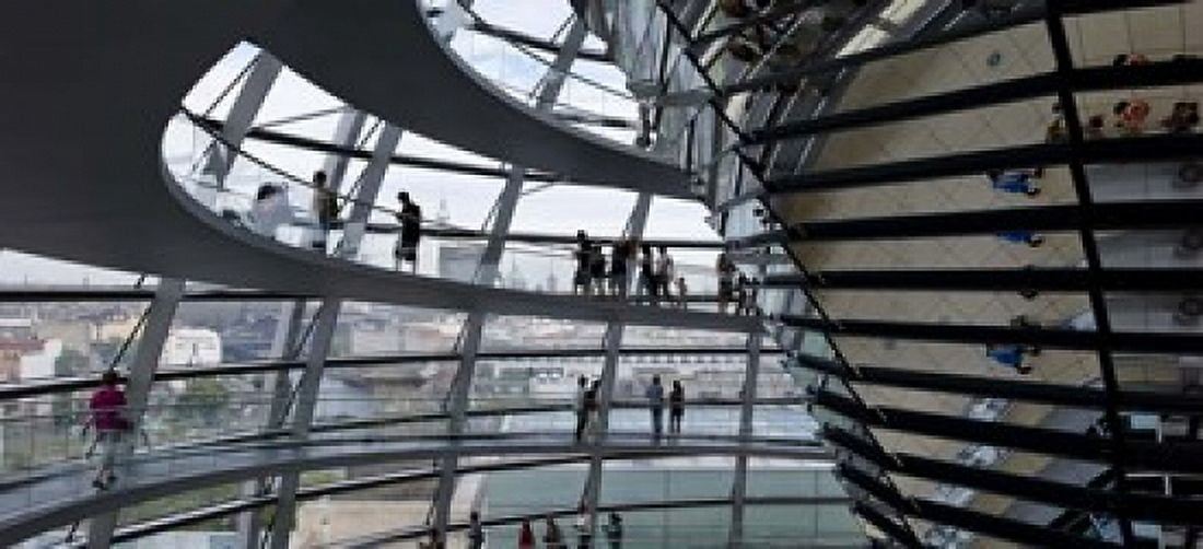 Tourists near the mirrored cone at the center of the dome Reichstag Dome The Reichstag Berlin Germany Canvas Art - Panoramic Images (15 x 7)