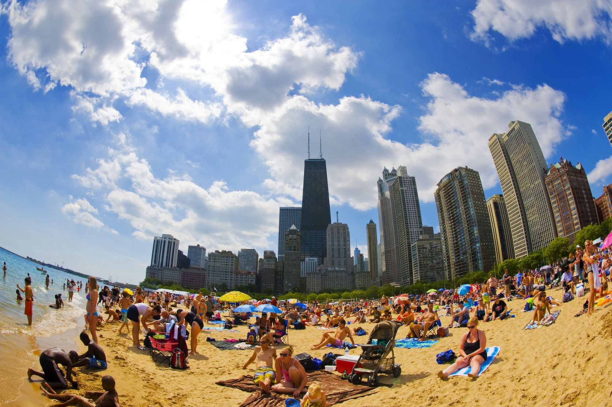 Tourists on a beach Oak Street Beach Lake Shore Drive Lake Michigan Chicago Cook County Illinois USA Canvas Art - Panoramic Images (27 x 9)