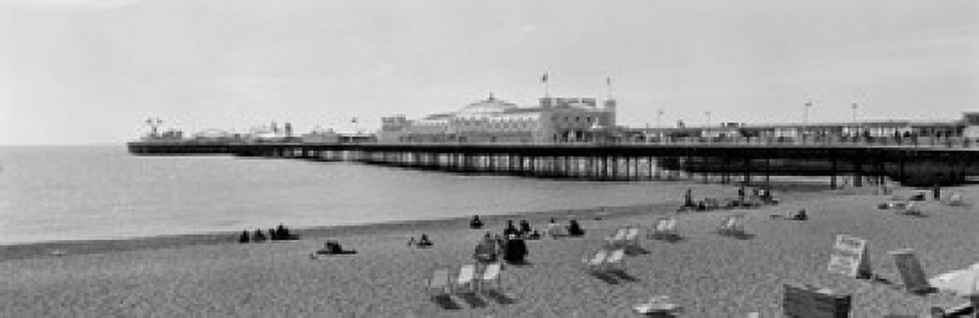 Tourists on the beach Brighton England Canvas Art - Panoramic Images (18 x 6)