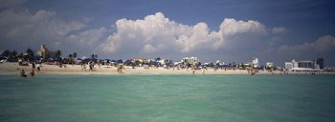 Tourists on the beach Miami Florida USA Canvas Art - Panoramic Images (18 x 7)