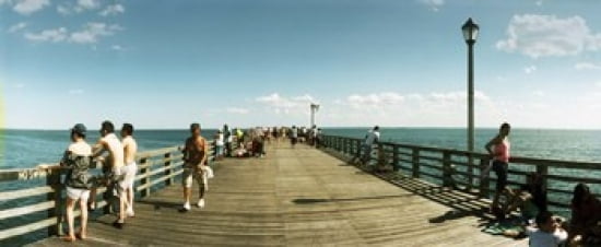 Tourists on the beach at Coney Island viewed from the pier Brooklyn New York City New York State USA Canvas Art - Panoramic Images (30 x 13)