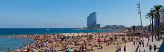 Tourists on the beach with W Barcelona hotel in the background Barceloneta Beach Barcelona Catalonia Spain Canvas Art - Panoramic Images (36 x 12)