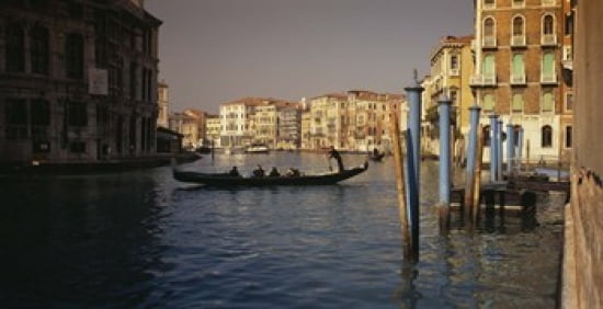 Tourists sitting in a gondola Grand Canal Venice Italy Canvas Art - Panoramic Images (24 x 12)