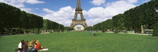Tourists sitting in a park with a tower in the background Eiffel Tower Paris Ile-de-France France Canvas Art - Panoramic Images (36 x 12)
