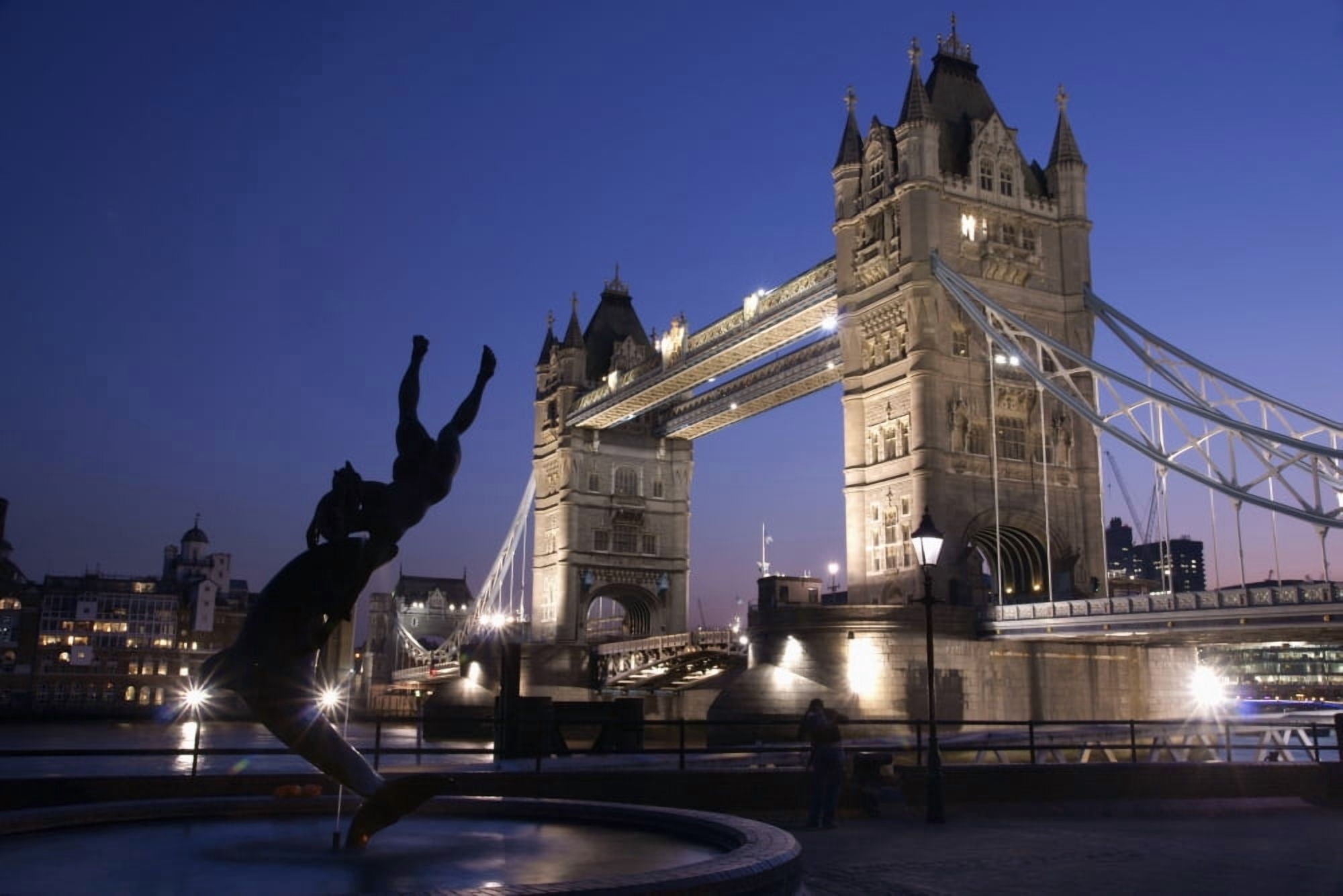 Tower Bridge At Dusk With Dolphin Statue In The Foreground Canvas Art - Marc Jackson Design Pics (19 x 12)