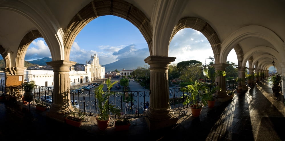 Town viewed through from a palace Palacio De Los Capitanes Generale Antigua Guatemala Guatemala Canvas Art - Panoramic Images (27 x 9)