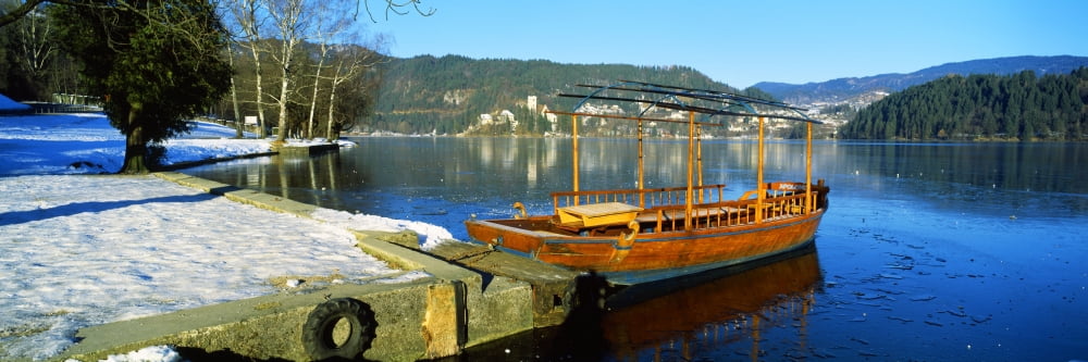 Traditional boat docked at a port Lake Bled Slovenia Canvas Art - Panoramic Images (27 x 9)