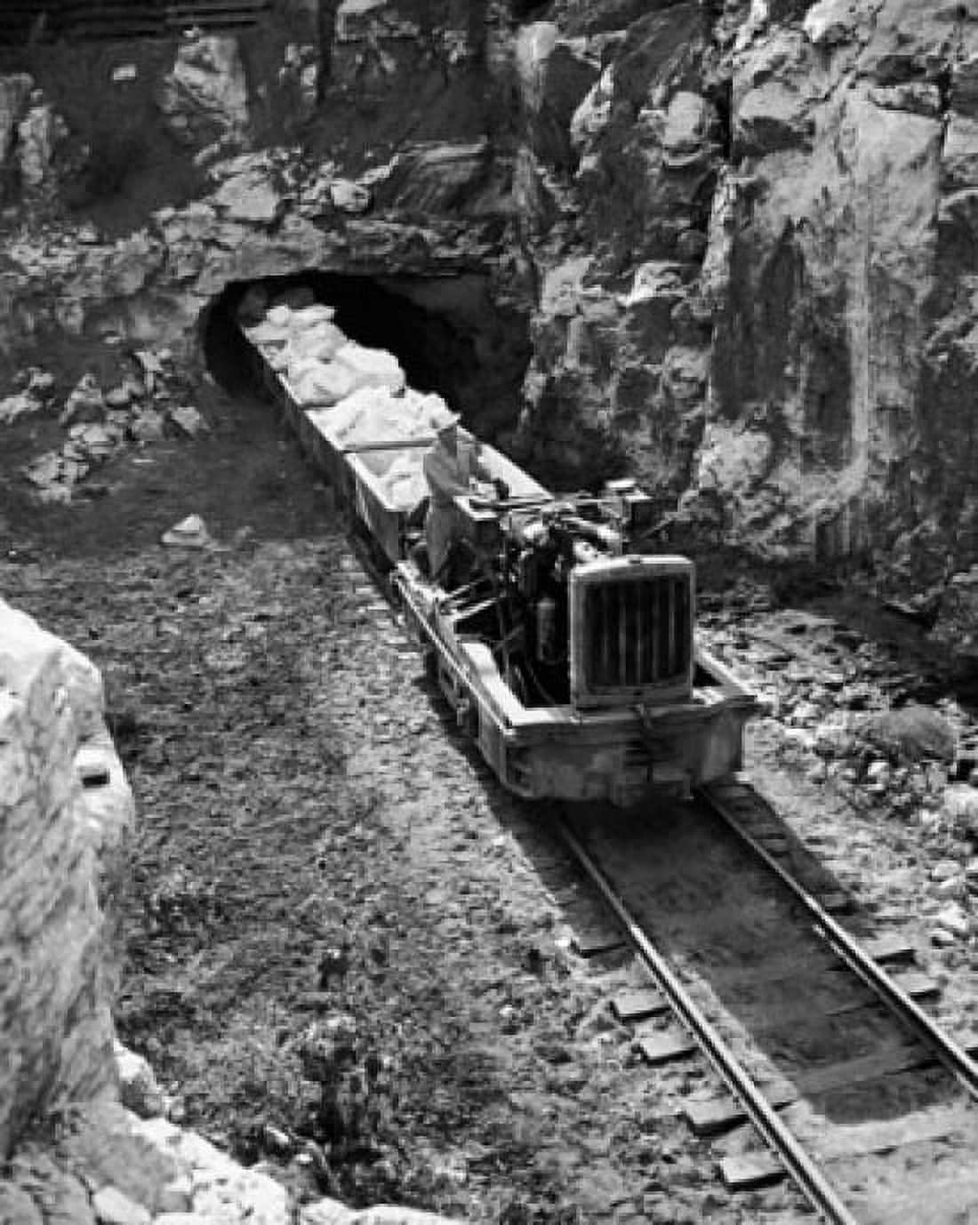 Train coming out from a tunnel with gypsum rocks from a mine Canvas Art - (18 x 24)