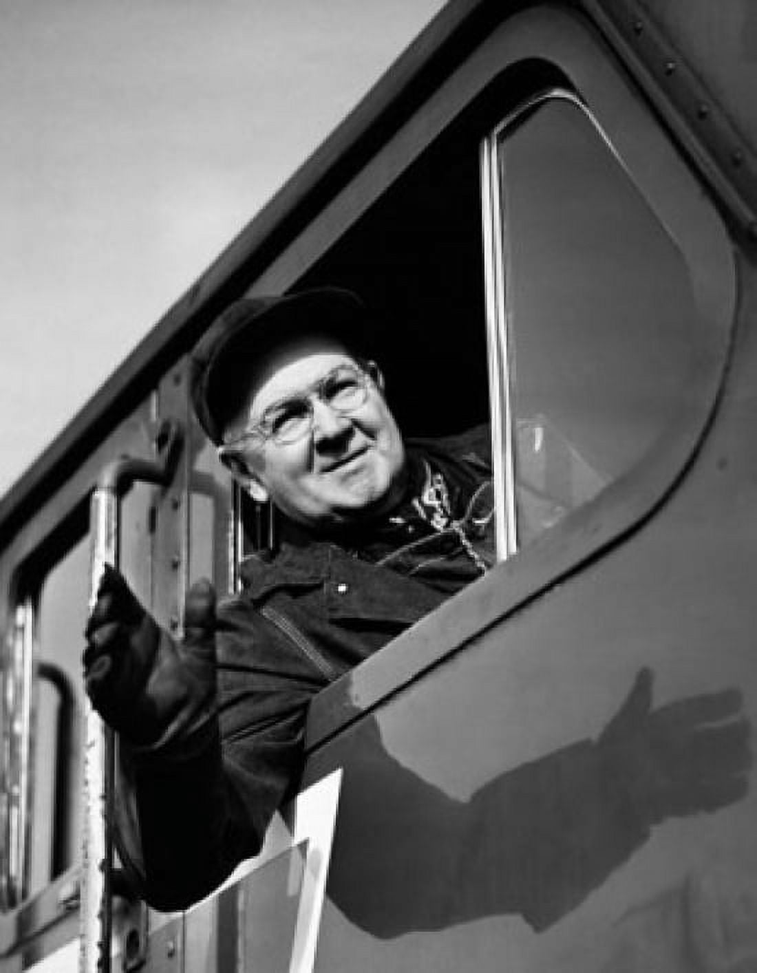Train conductor leaning out of engine window Canvas Art - (24 x 36)