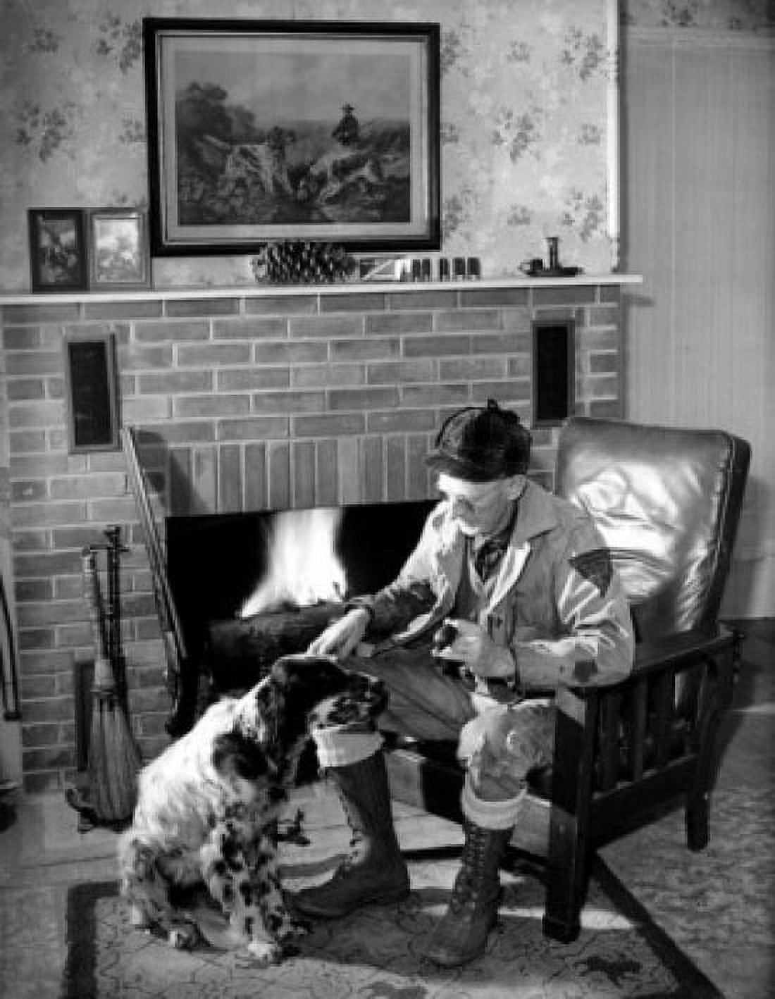 Tramp stroking dog in front of fireplace holding pipe Canvas Art - (18 x 24)