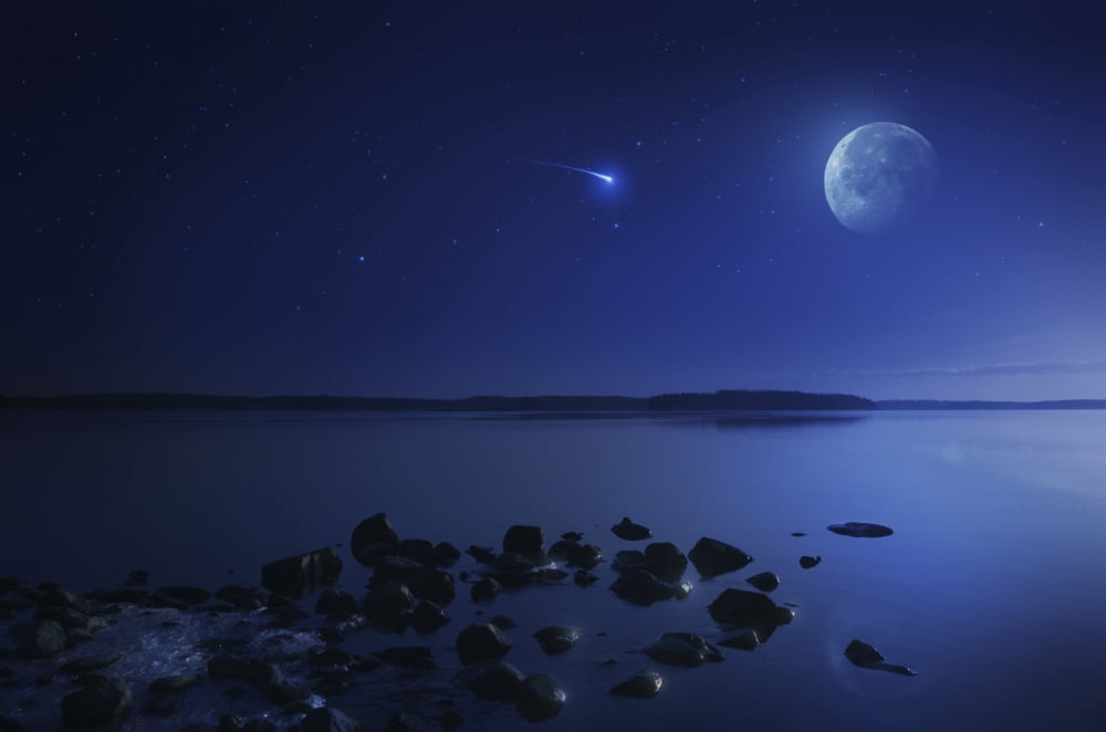 Tranquil lake against starry sky moon and falling meteorite Finland Canvas Art - Evgeny KuklevStocktrek Images (35 x 23)