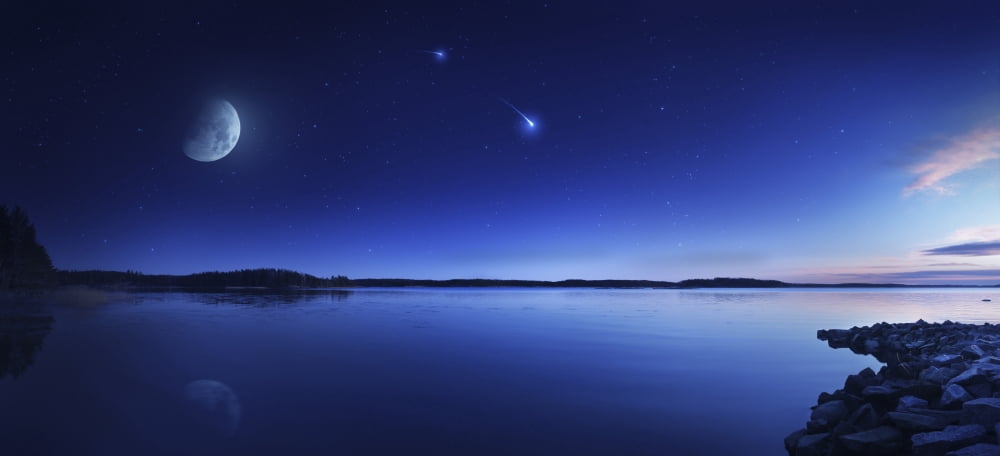 Tranquil lake against starry sky moon and falling meteorite Finland Canvas Art - Evgeny KuklevStocktrek Images (42 x 20)