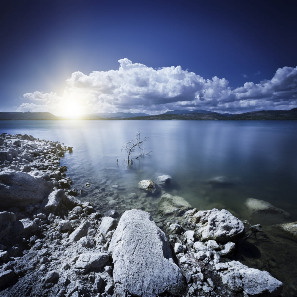 Tranquil lake and rocky shore with sun over horizon Sardinia Italy Canvas Art - Evgeny KuklevStocktrek Images (29 x 29)