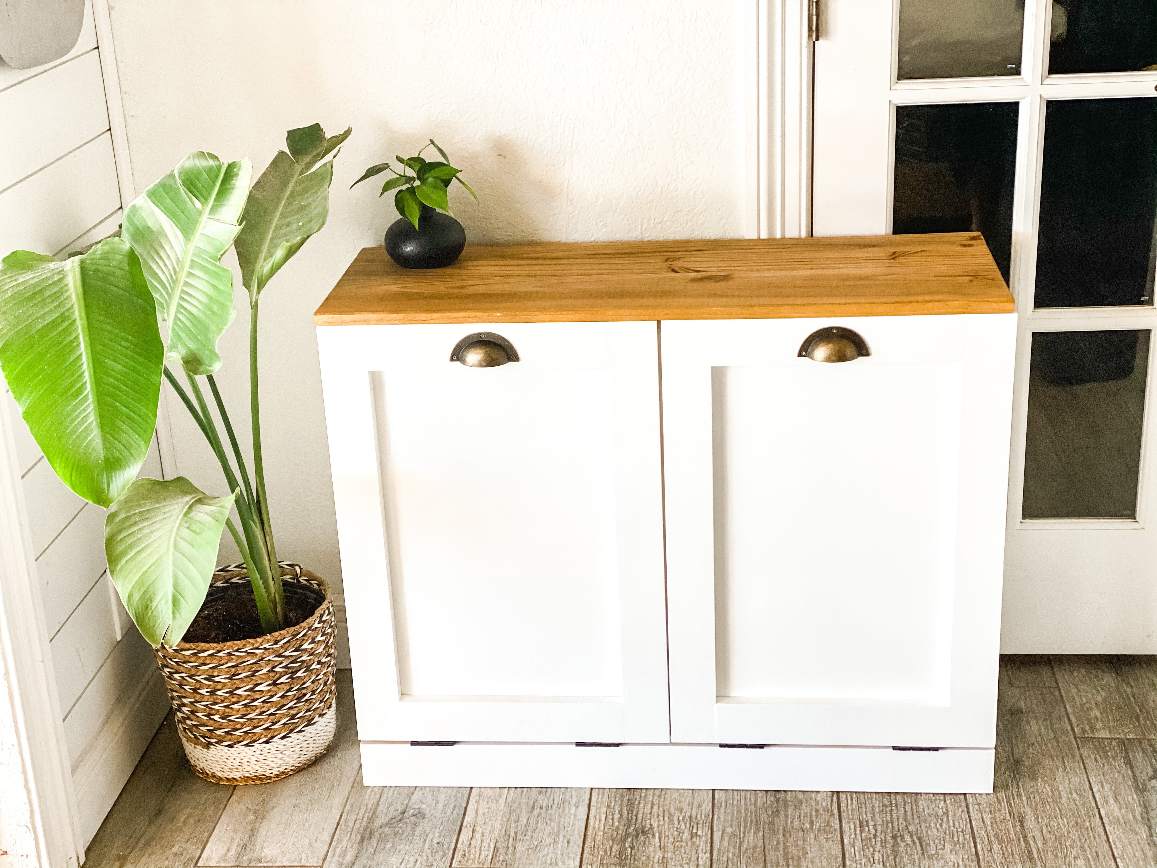 https://i5.walmartimages.com/seo/Trash-Can-Cabinet-Tilt-Out-Cabinet-Wood-Trash-Recycle-Bin-Laundry-Hamper_9e074a43-48f7-448b-8137-31f4ba9fb8b2.448bb38bdfd668c2b04297bb034f5eee.jpeg