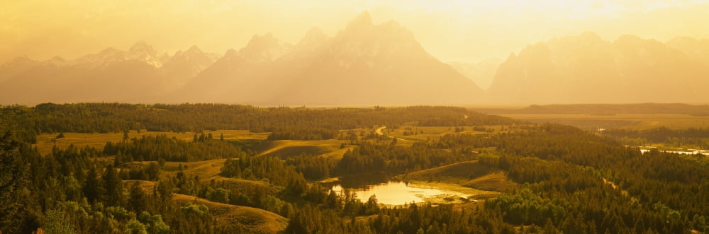 Trees on a landscape with a mountain range in the background Jackson Hole Teton Range Grand Teton National Park Wyoming USA Canvas Art - Panoramic Images (27 x 9)