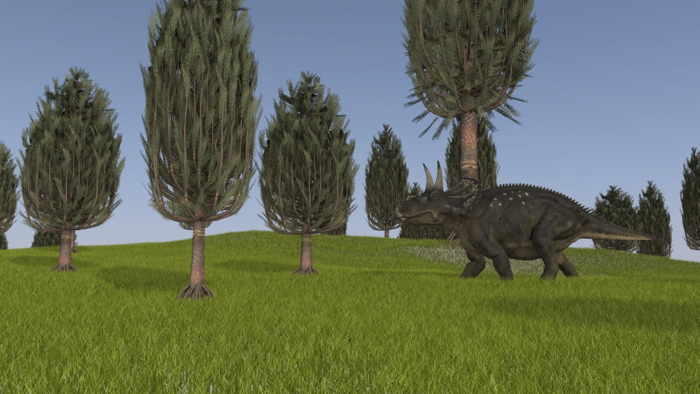 Triceratops walking across a grassy field Canvas Art - Kostyantyn IvanyshenStocktrek Images (19 x 11)