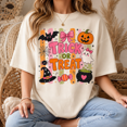 thumbnail image 1 of Trick Or Treat Halloween T-Shirt, Cute Ghost Pumpkin Graphic Tee, Coquette Spooky Season Shirt, Pink Halloween Candy Apparel Gift for Her - Ivory, 2XL, 1 of 1