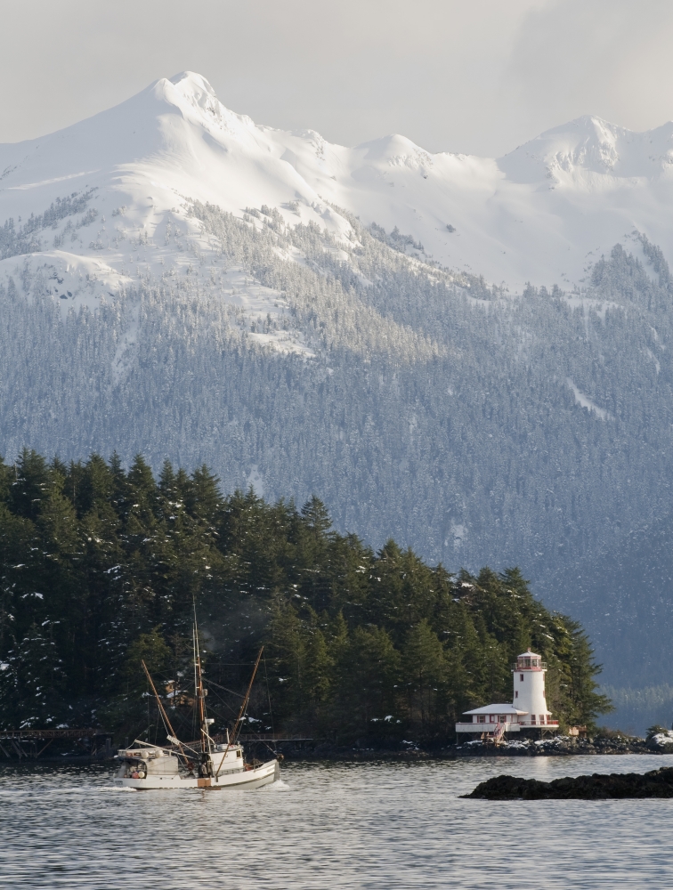 Troller Heads Out Of The Sitka Harbor As It Passes By The Rockwell Lighthouse With Mt Longenbaugh In The Background In Southeast Alaska During Winter Canvas Art - Chris Miller Design Pics (24 x 34)