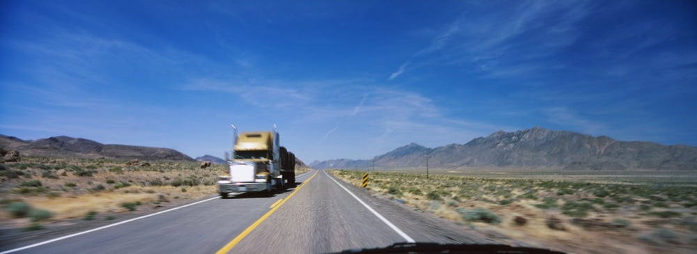 Truck on a highway viewed through windshield of a car Nevada USA Canvas Art - Panoramic Images (27 x 9)