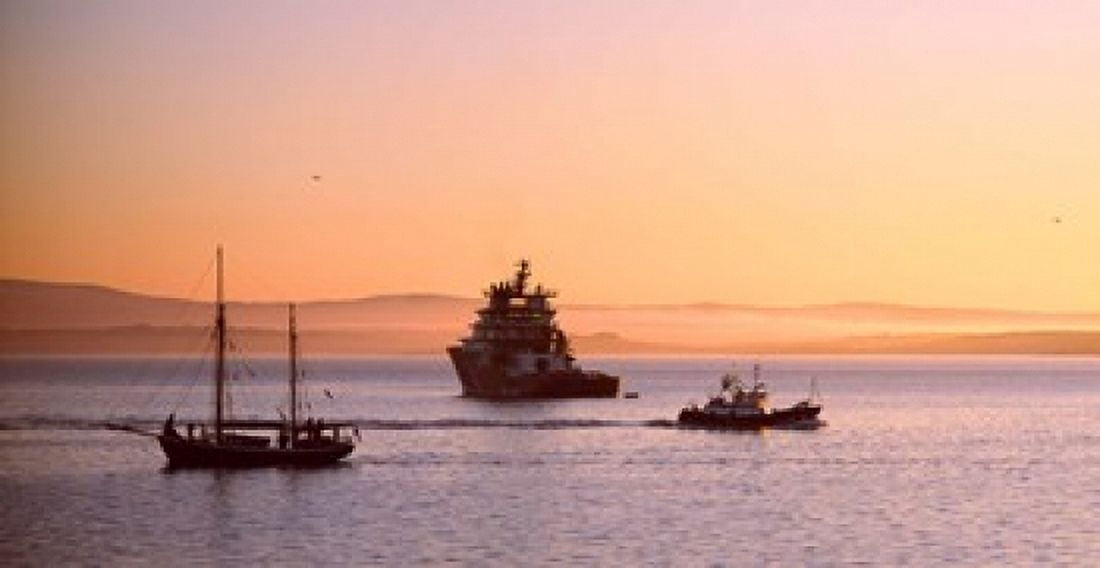 Tugboat with a trawler and a tall ship in the Baie de Douarnenez at sunrise Finistere Brittany France Canvas Art - Panoramic Images (36 x 19)