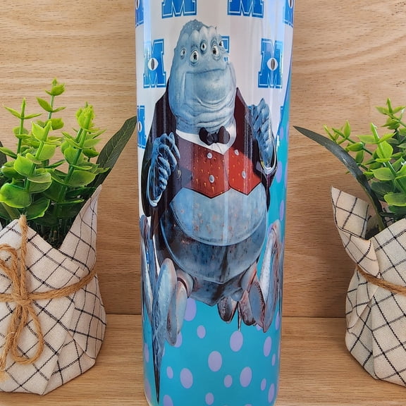 Tumbler/cup. 20 oz skinny tumbler. Monster Friends. With Henry J. Waternoose iii. Monster Friends. character. Teal with purple polka - dots background