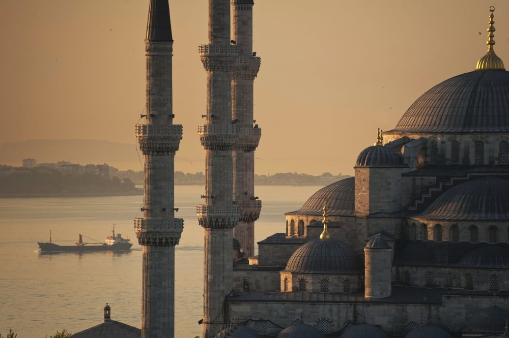 Turkey Ship sailing along Bosphorus behind Sultanahmet or Blue mosque at dawn Istanbul Canvas Art - Ian Cumming  Design Pics (38 x 24)