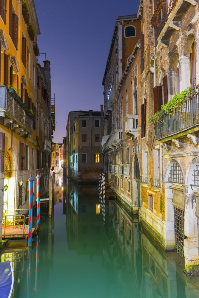 Turquoise water in a narrow canal between buildings at dusk Venice Veneto Italy Canvas Art - Mats Silvan Design Pics (12 x 19)