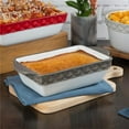 thumbnail image 1 of Tuxton EAF-202 1 qt. Porcelain White Embossed Rectangular Casserole - Black Truffle Band, 1 of 1