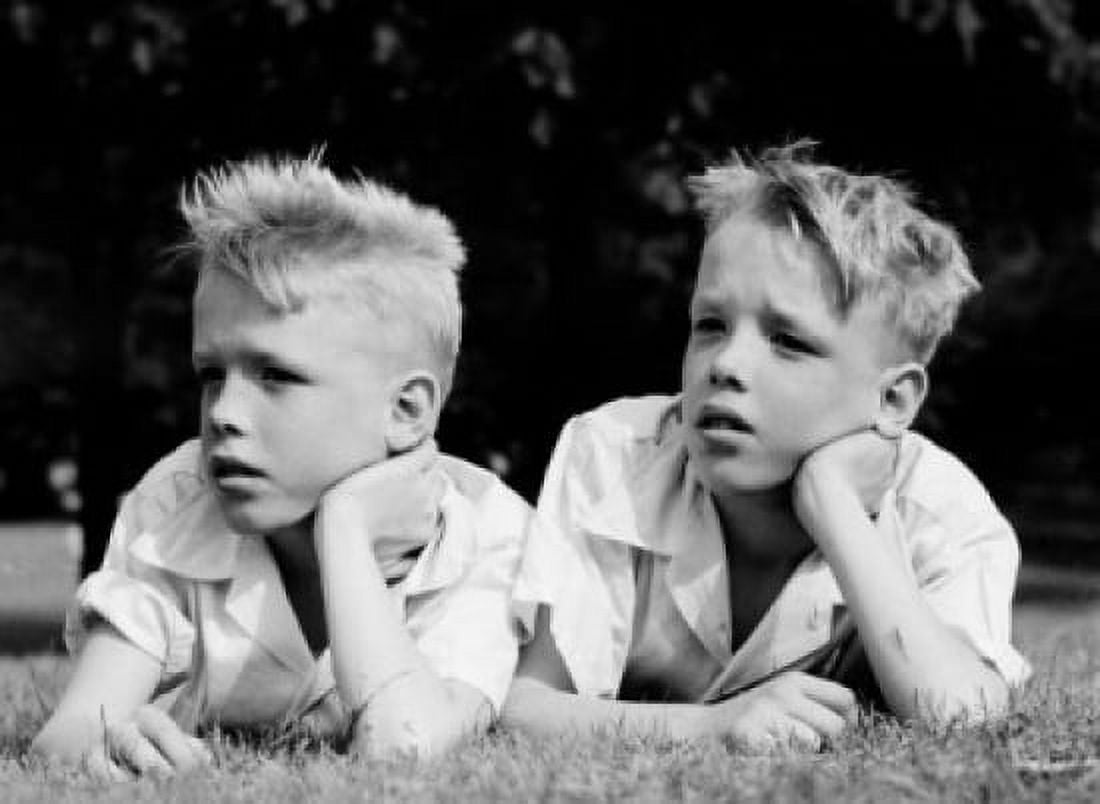 Twin boys lying on grass and looking away Canvas Art - (18 x 24)