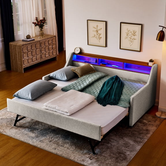Twin size beige linen sofa bed featuring three LED lights headboard storage wireless charging and foldable trundle for hassle - free charging and extra sleeping options in bedroom