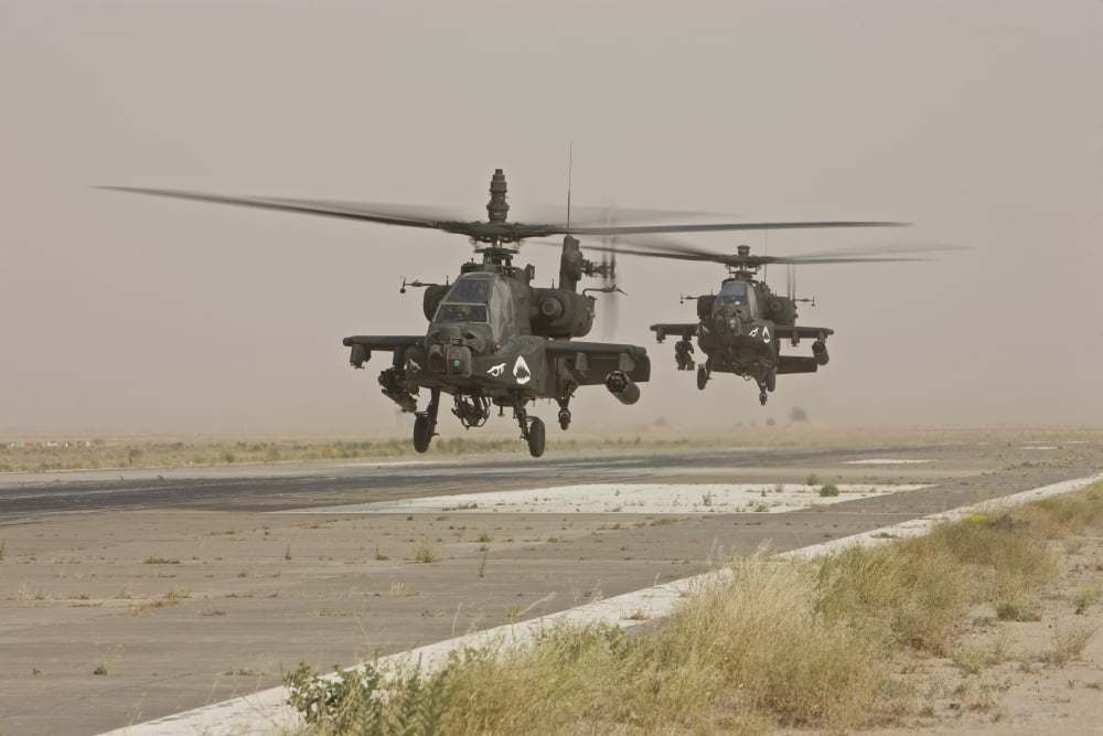 Two AH-64 Apache helicopters prepare to land on on the runway Canvas Art - Terry MooreStocktrek Images (35 x 23)