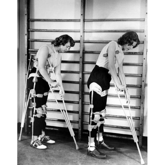 Two Adult Women Polio Victims With Leg Braces Adjust Their Crutches. They Are At The New York Institute Of Physical Medicine And Rehabilitation Where They Are Undergoing A Six Month Training Program.
